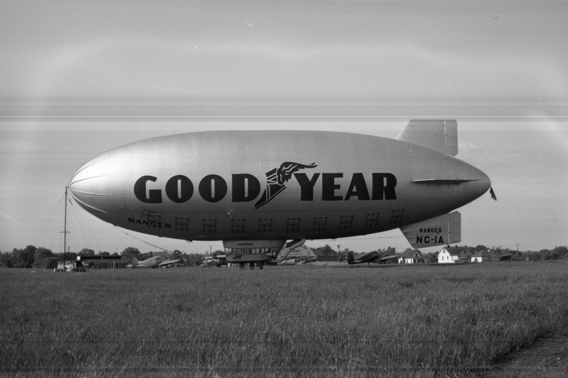 The Goodyear Ranger II (NC-1A) blimp docked to it's mobile station on June 13, 1947 at Buffalo Airpark. The Quonset hangar and operations building is seen in the background.
