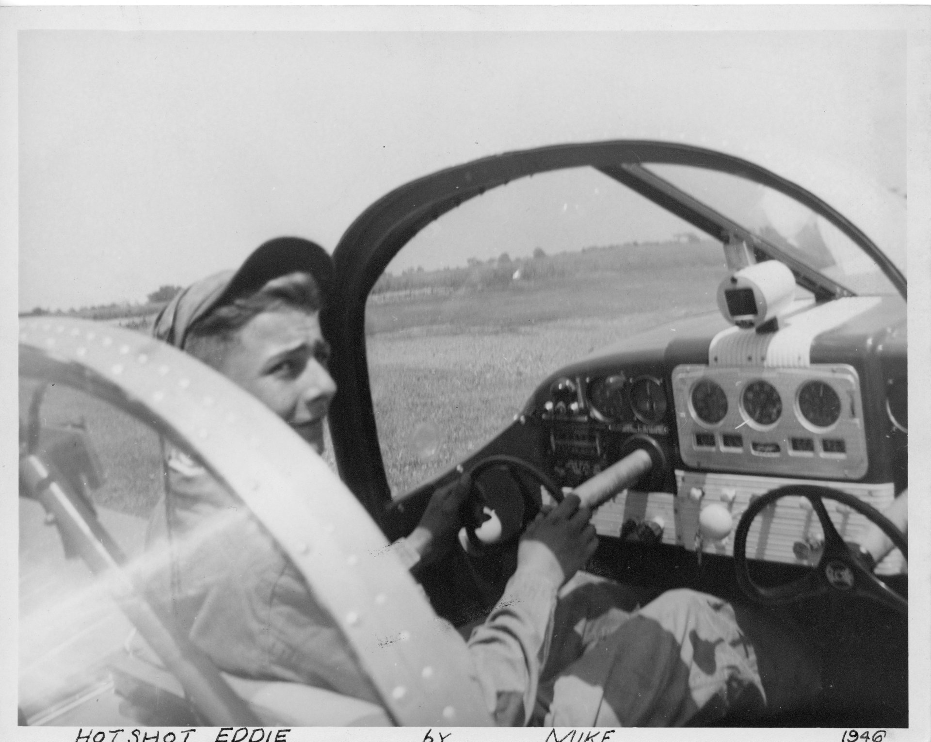 A person known as "Hot Shot Eddie" is sitting in the pilot's seat of a Globe Swift airplane at Buffalo Airpark dated 1946.