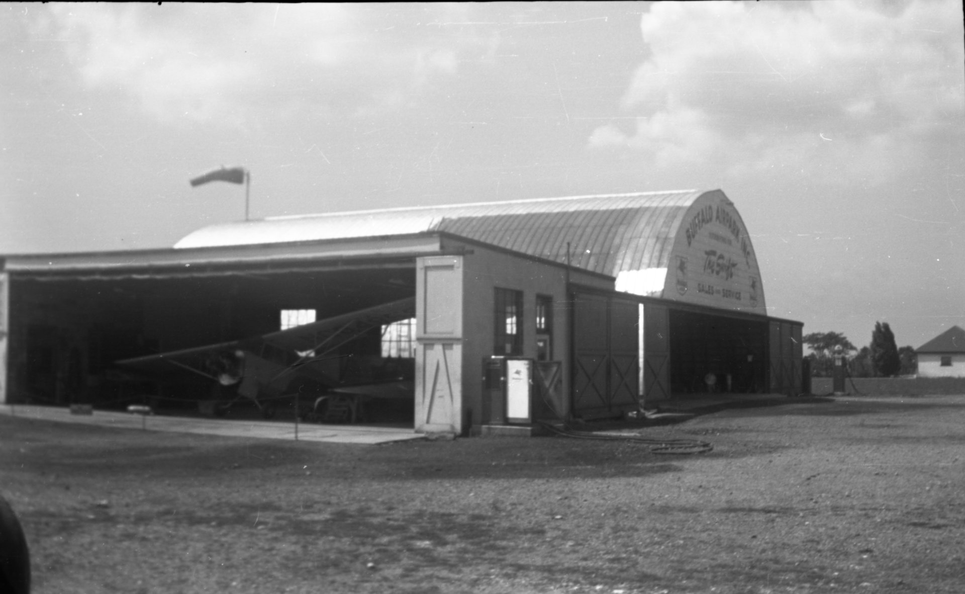 The Maintenance shop at Buffalo Airpark with the Quonset hangar in the background.