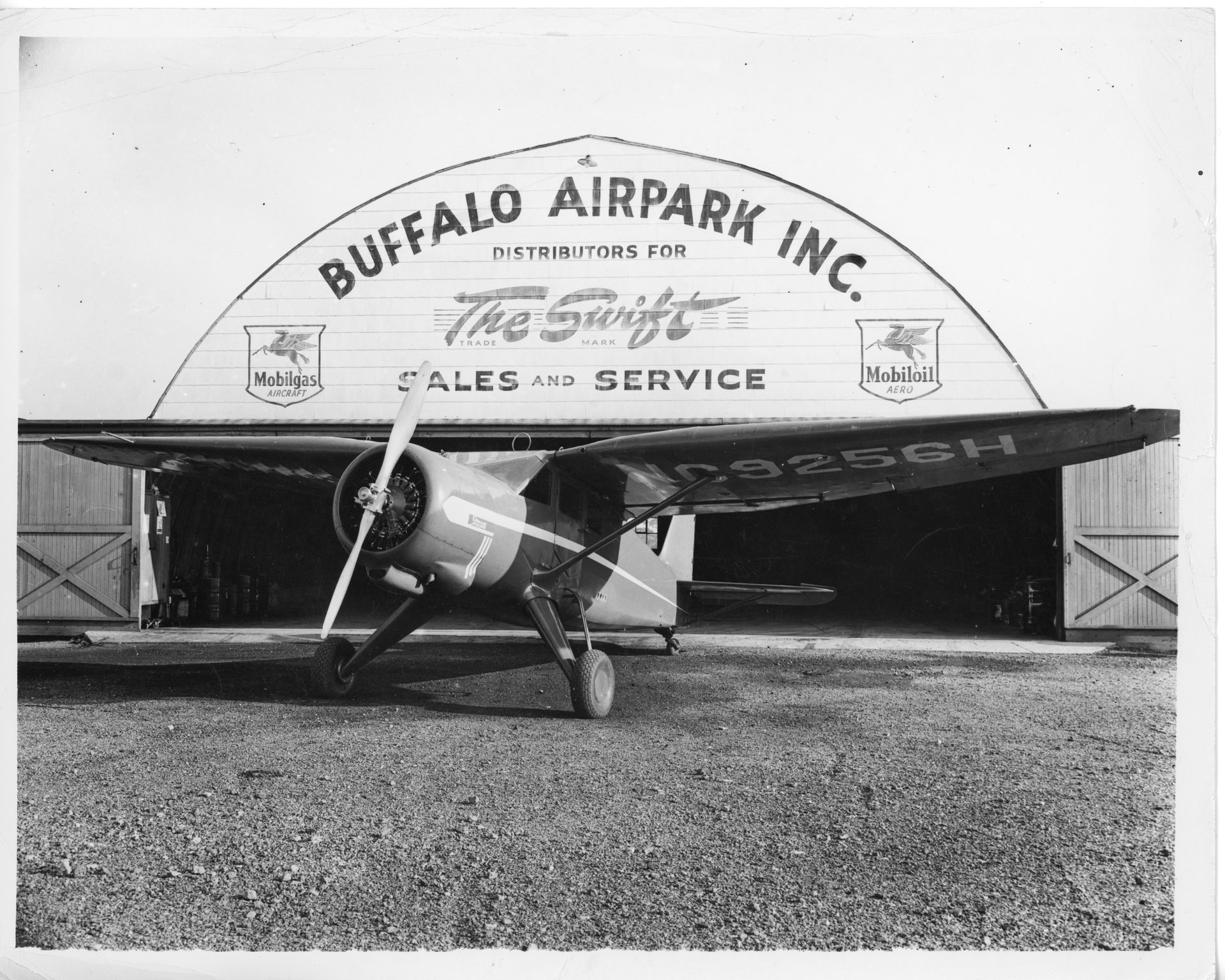 A 1946 Stinson Vultee V-77 parked in front of the Quonset hangar at Buffalo Airpark.