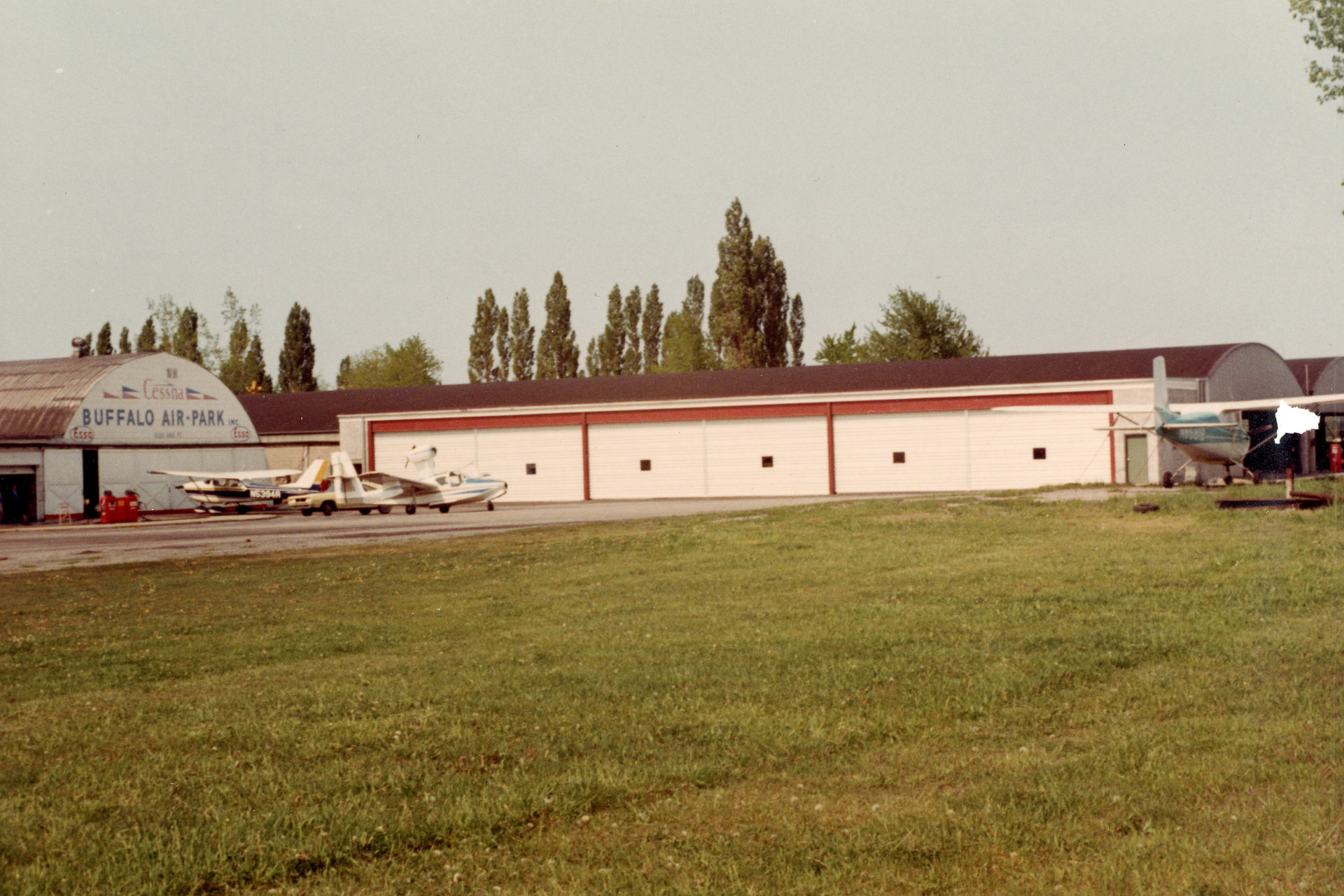 The twin hangars with the addition of three hangar bays at Buffalo Airpark.