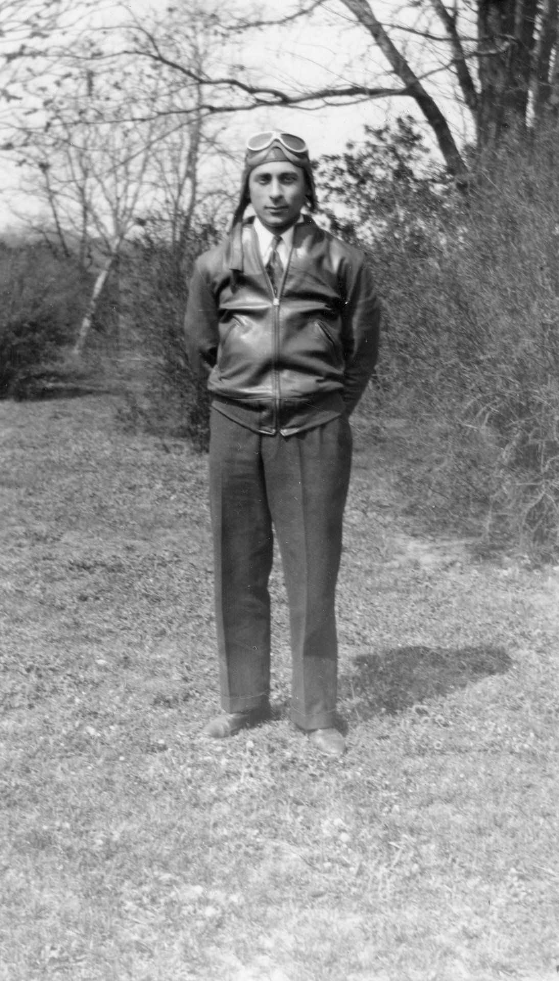 Tony Riccio wearing his leather flighting jacket, helmet, and goggles.