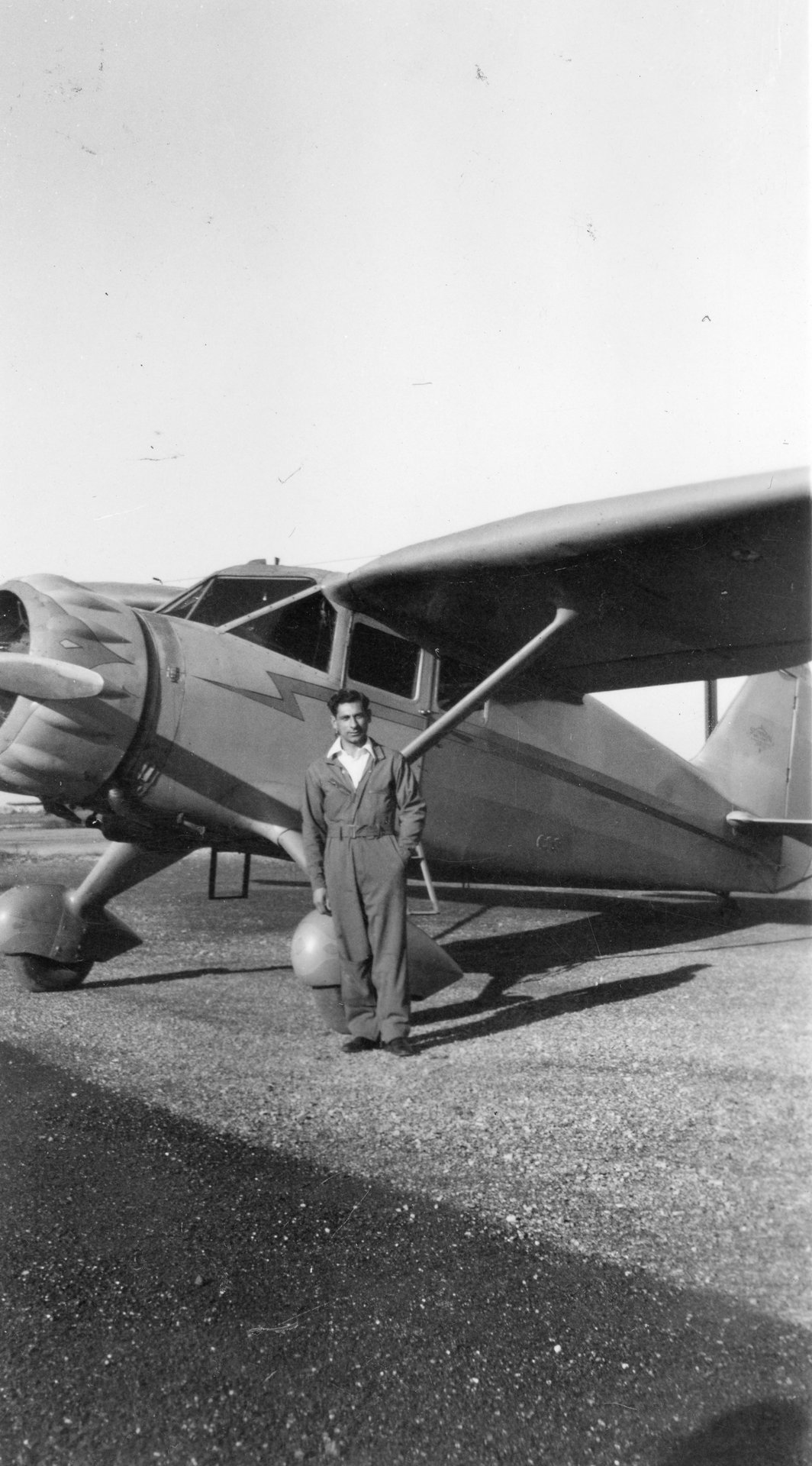 Tony Riccio standing next to a Stinson Reliant SR7 airplane.
