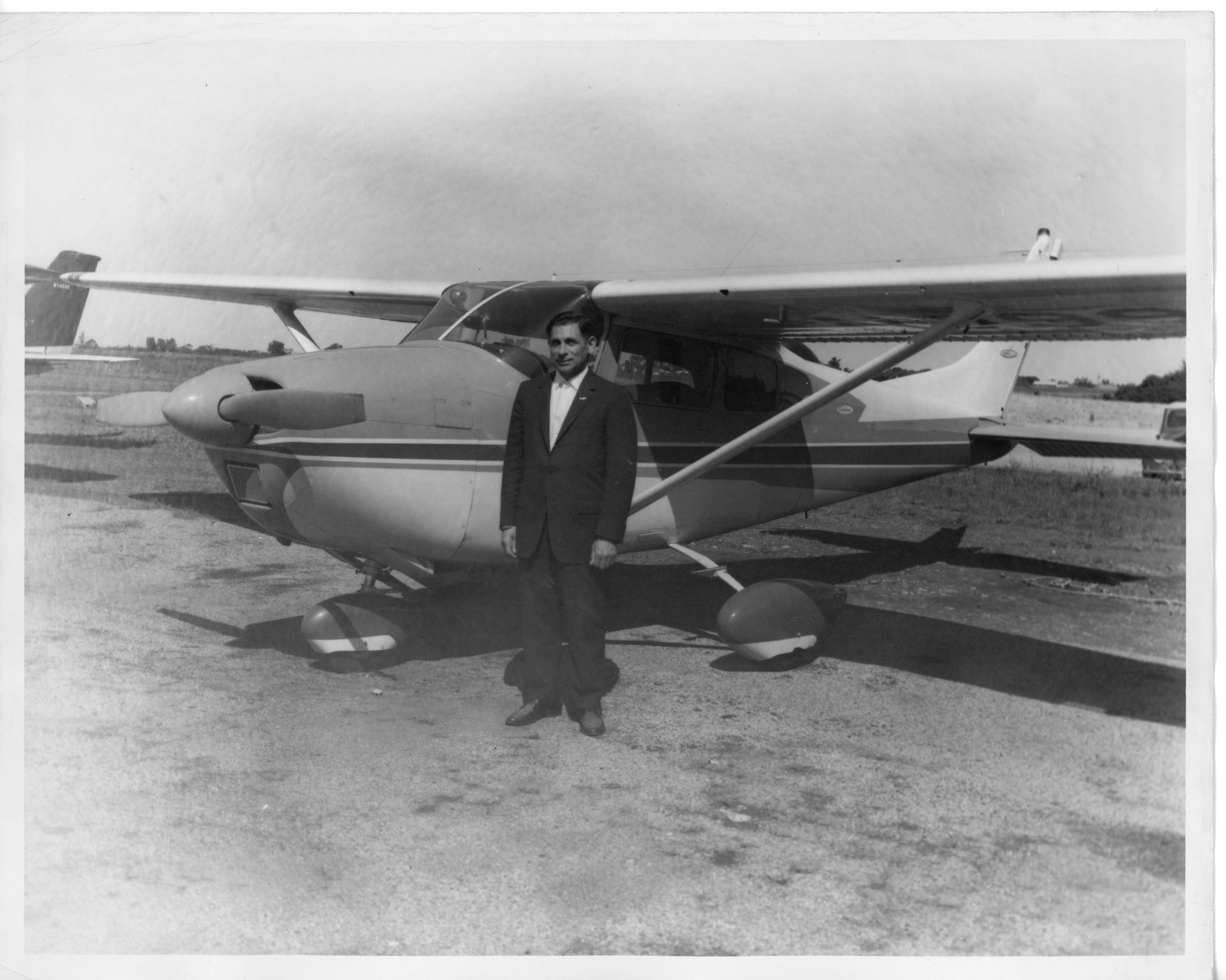 Tony Riccio standing next to a Cessna Skylane.