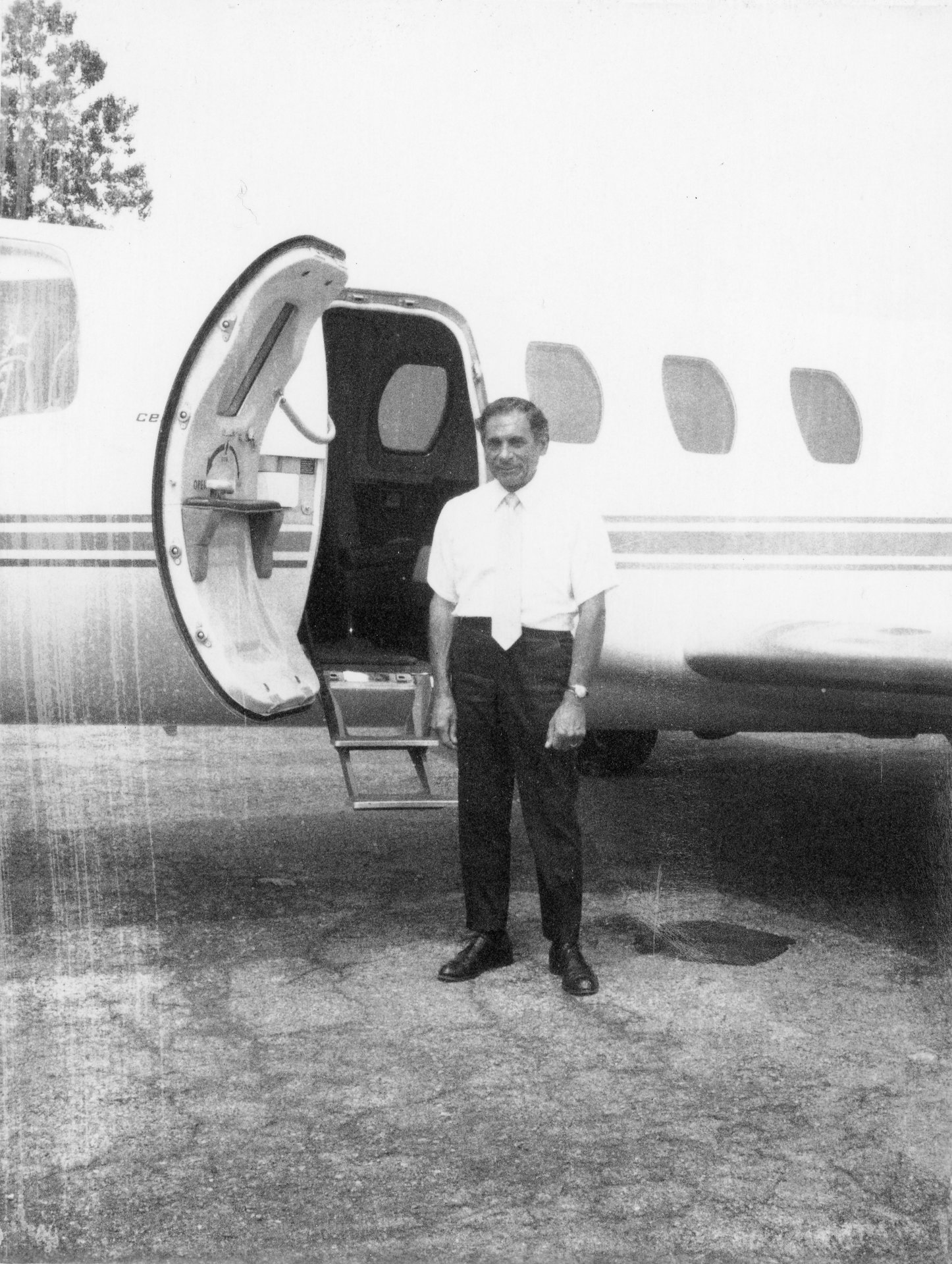 Tony Riccio standing next to a Cessna Citation 500.