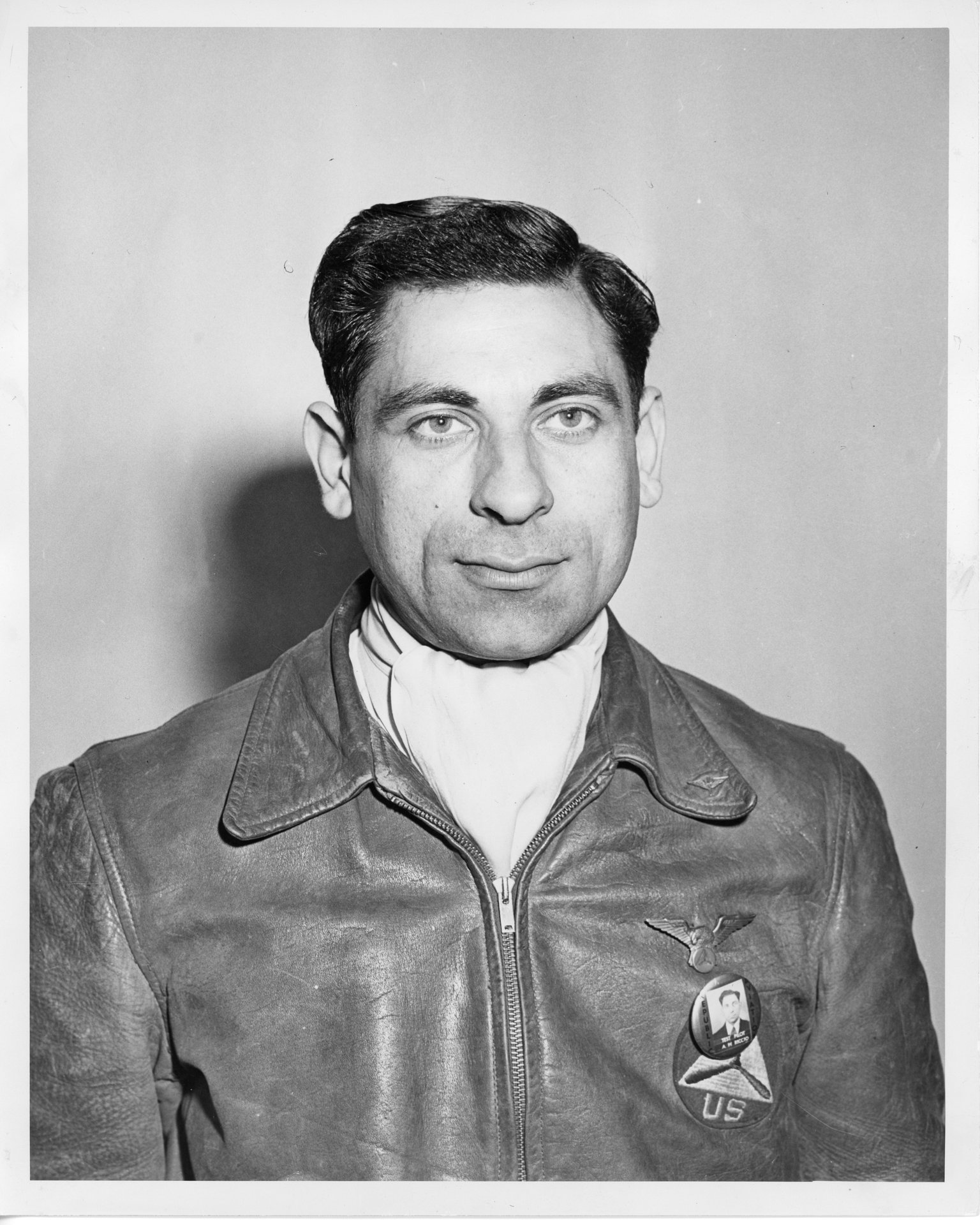 Tony Riccio wearing a leather flight jacket with his Republic photo identification pin.