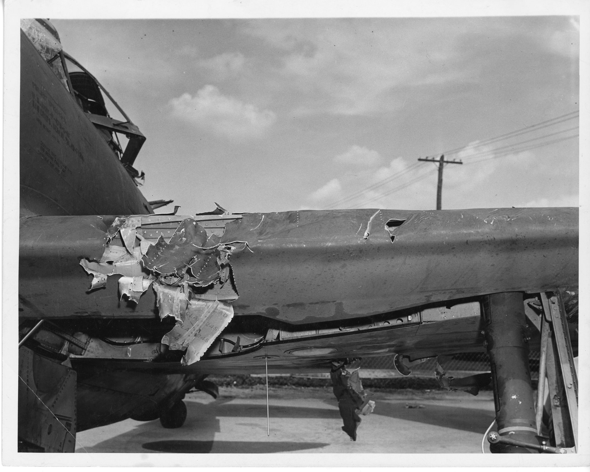 Damage to Tony's P-47 left wing's leading edge near the fuselage.