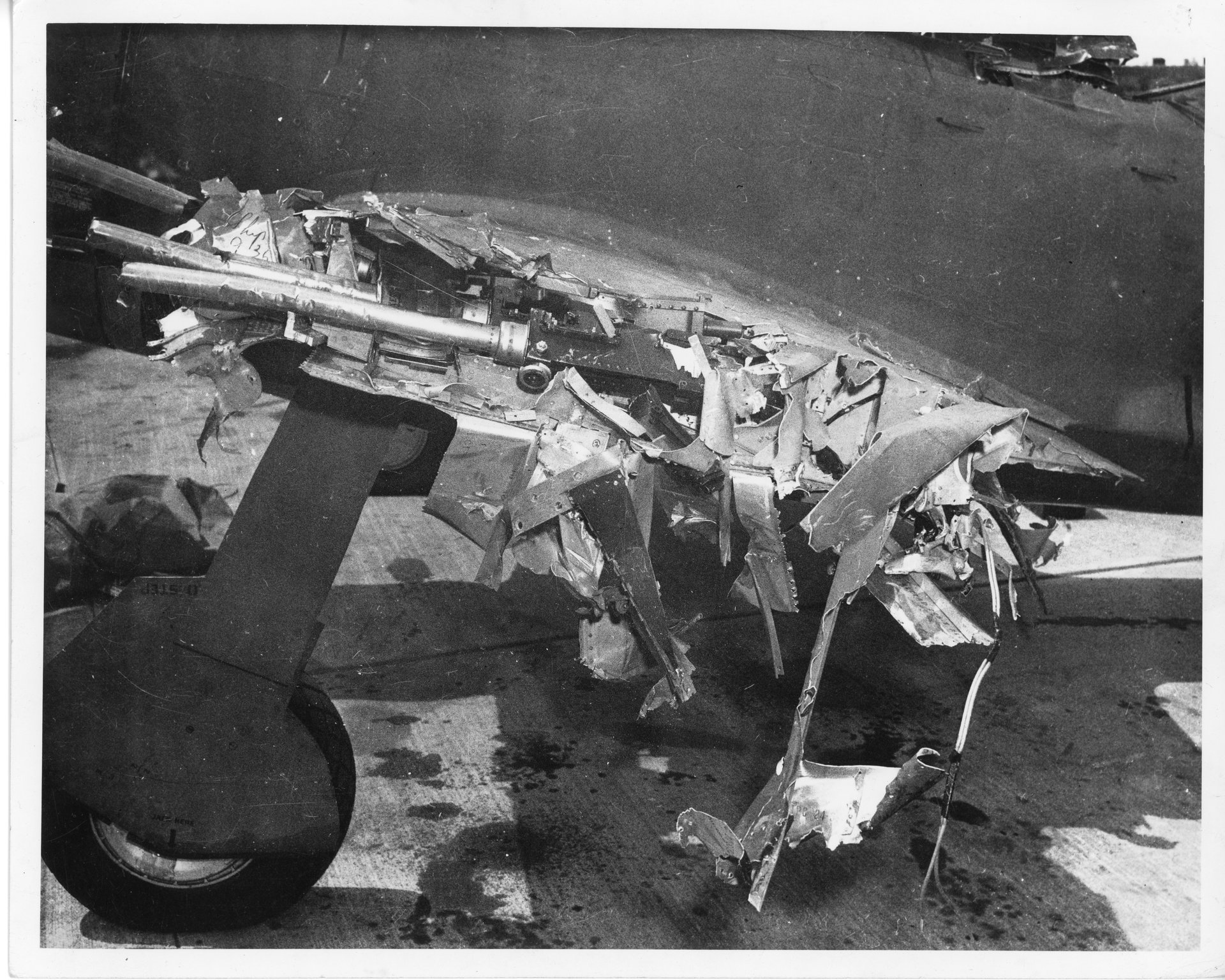 The left wing on Tony's P-47 has been sheared off just past the 50mm machine guns.